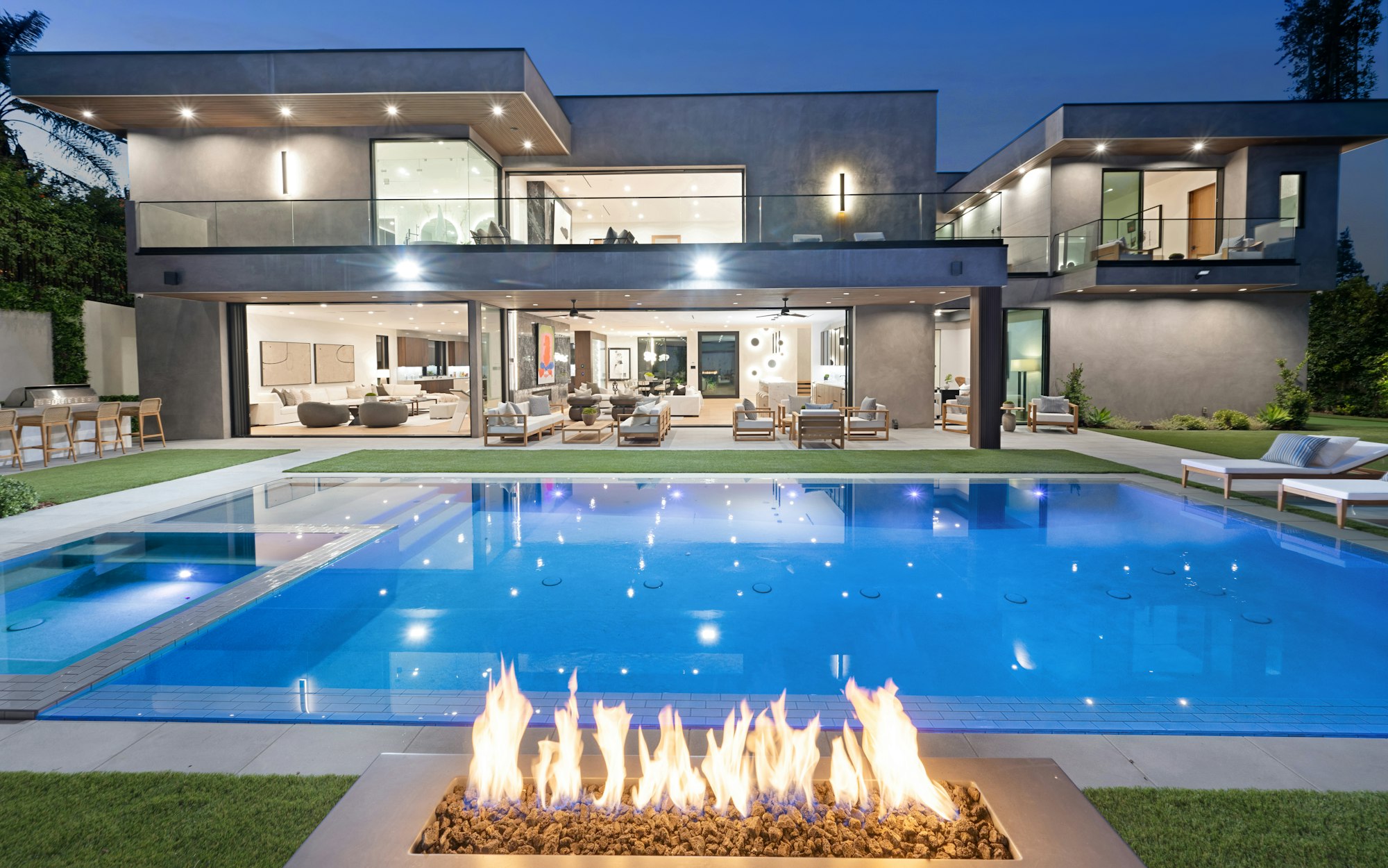 Fire pit near a pool on the ground, New Construction Home in Tarzana, California